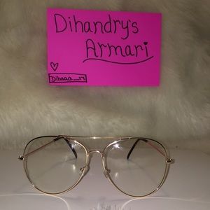 Gold framed, clear lenses glasses.